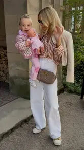 A montage of a family's day out in the Lake District, featuring visits to a cafe, a chocolate shop, a boat ride, and a park. The video focuses on the family's interactions and the scenic surroundings rather than specific venue details.