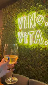 A promotional video showcasing the atmosphere, food, and drinks at Vino Vita. The footage highlights the venue's interior and outdoor seating, featuring shots of sharing platters, lasagne, pasta, and wine, set to an upbeat soundtrack with a live DJ.