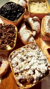 A short video showcasing a box of various Polish pastries and cakes, with the creator sampling each one to determine a favorite.
