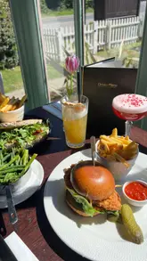 A promotional montage showcasing the interior, exterior, and food/drink offerings of The Hawk pub in Battlesbridge.