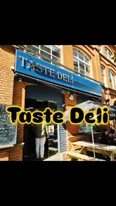 A compilation video showcasing various hot wraps and deli food items from Taste Deli in Belfast, featuring close-up shots of the food and menu boards.