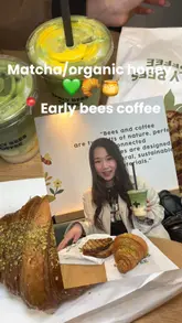A creator visits Early Bees Coffee to review their matcha-based drinks and food offerings. The video features close-ups of various matcha lattes, a pistachio croissant, and a pesto sandwich, accompanied by the creator's commentary on the taste and menu.