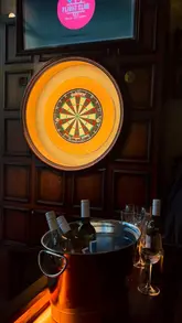 A fast-paced, music-led montage showcasing the interior, atmosphere, social darts games, cocktails, and food offerings at a Flight Club venue.