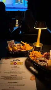 A reel showcasing an immersive cinema experience at Eatflix, where guests are served food and drinks themed around the movie being screened, in this case, The Simpsons Movie.