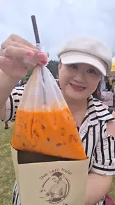 A vibrant, fast-paced vlog documenting a visit to the Magic of Thailand Festival. The creator samples a wide array of authentic Thai street food, including braised pork, papaya salad, and durian ice cream, while also highlighting cultural elements like traditional dance performances, cooking demonstrations, and a temple blessing.