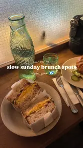 A listicle-style video showcasing four different brunch venues in Glasgow, featuring close-ups of various brunch dishes and brief glimpses of the cafe interiors.