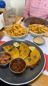 A fast-paced listicle video highlighting six different food and drink venues in Norwich, featuring a variety of dishes including BBQ meat platters, burgers, pizza, and steak.