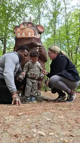 A family-focused reel showcasing a visit to the Gruffalo Trail at Thorndon Country Park. The video follows a toddler exploring the woodland path, interacting with various wooden character statues, and playing in the forest, highlighting the suitability of the location for young children.