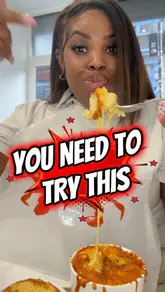 A creator reviews 'Soulful Seafood' in London, highlighting their seafood boil, mac and cheese, and cornbread. The video features the creator eating the food, showing close-ups of the dishes, and providing commentary on the quality and taste.