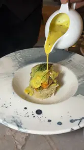 A promotional reel for Bagaara Utsav in Roundhay, Leeds, featuring a preview dinner experience. The video includes shots of the restaurant's interior, a live singer, and a variety of dishes including palak patta chaat and lamb rogan josh, narrated by the creator.