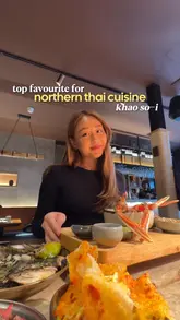 A vibrant and well-edited food review of Khao So-i in London, focusing on their signature Northern Thai khao soi noodle soup. The video features a mix of close-up shots of food preparation, detailed shots of the final dishes, and the creator enjoying the meal, providing a comprehensive look at the dining experience.