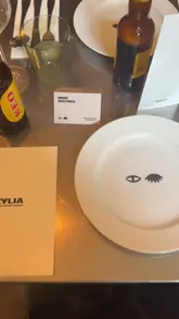 A montage video capturing an industry dinner event at Zylia Taverna. The video features shots of the table setting, the printed menu, the restaurant interior, and various Greek and Cypriot dishes being served to guests.