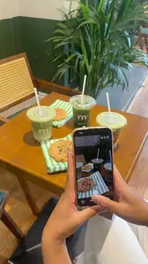 A promotional reel for m+ matcha in Leeds, featuring a variety of matcha-based drinks, gelato, and cookies. The video highlights the cafe's interior, the preparation process, and the social atmosphere.