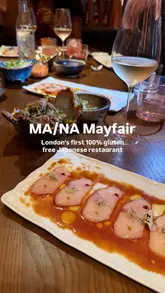 The creator visits MA/NA in Mayfair, London, highlighting its status as a 100% gluten-free Japanese restaurant. The video features a tour of the stylish interior, a look at the bar, and a detailed walkthrough of their tasting menu, including dishes like truffle edamame, tempura, sushi, and a chocolate fondant dessert.