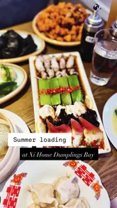 A fast-paced montage showcasing a variety of Chinese dishes, including dumplings, seafood, and stir-fried chicken, at Xi Home.