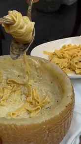 A high-quality montage showcasing the interior, rooftop terrace, and various dishes at Sparrow Italia in Mayfair, including table-side pasta preparation and cocktails.