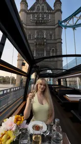 This video showcases a luxury 6-course dining experience on a bus tour through London. It features high-quality shots of the interior, the food, and the passing city landmarks, creating an aspirational and elegant atmosphere.