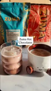 A creator demonstrates how to prepare hot and iced chocolate drinks using Zuma hot chocolate powders in a home kitchen setting.