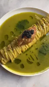A short montage showcasing several plated dishes, including matcha tagliatelle with tuna tartare and caviar, French toast, fried zucchini flowers, and a raw fish carpaccio.