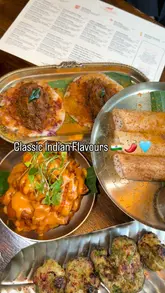 A review of an Indian gastropub in Archway, featuring a variety of starters, mains, and desserts, along with cocktails.