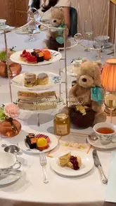 A short, aesthetic video showcasing the Winnie the Pooh-themed afternoon tea experience at Fortnum & Mason, featuring close-ups of themed cakes, tea service, and branded merchandise.