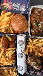 A creator unboxes a takeaway order from Chicken George delivered via the GoGetters app, showcasing various menu items like burgers, wings, and mac and cheese.