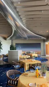 A short video showcasing the 'Soleil by Claude' pop-up on the rooftop terrace of The Peninsula London. The footage captures the elegant table settings, a variety of Mediterranean dishes, cocktails, and the panoramic city views, highlighting the venue's upscale atmosphere.