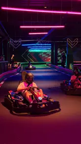 A promotional video showcasing the new Hollywood Bowl venue in Cardiff, highlighting various entertainment options including go-karting, bowling, interactive darts, and arcade games, alongside casual food offerings.