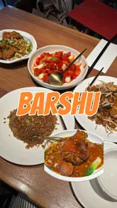 A review of Barshu, a Sichuan restaurant in Soho, London, celebrating its 20th anniversary. The video features a variety of dishes including salt and pepper ribs, prawn ho fun, prawn fried rice, sweet and sour chicken, and braised pork shank, along with mocktails.