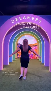 A promotional reel showcasing the House of Dreamers immersive exhibition in London. The video features a montage of various colorful, themed rooms, including ball pits, floral installations, and neon-lit spaces, designed for photo opportunities and interactive play.