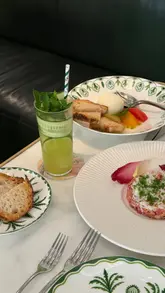 A montage showcasing the interior, bar, terrace, and menu items at Dante Mayfair, located within Claridge's hotel.