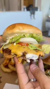 A couple visits Bailey's Burger Bar & Dessert Parlour in Tylorstown, reviewing their smash burgers, loaded fries, milkshakes, waffles, and brownies.