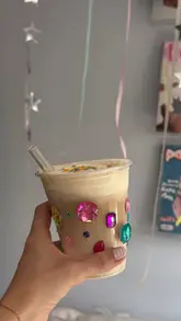 A lifestyle-focused video showcasing a 'solo date' morning ritual, featuring the preparation of an iced coffee using a L'OR coffee machine and a visit to a park with a bagel.