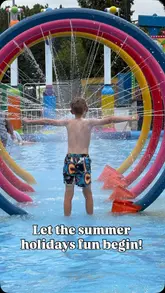 A montage of a family day out at a fairground and splash park, featuring various rides, water activities, and family entertainment.