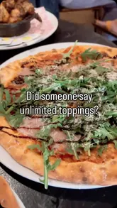 A fast-paced montage showcasing the pizza-making process, drinks, and dining experience at Pizza Punks in Belfast, featuring a family enjoying their meal.
