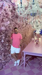 A montage video showcasing the various immersive rooms and photo installations at the House of Dreamers venue in London, featuring a couple interacting with the exhibits.