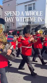 A travel-focused video clip showing a marching band in Windsor, used as part of a 'day in the life' style itinerary.