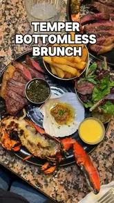 A review of the bottomless brunch at Temper, showcasing the food (steak, lobster, oysters, prawns) and drinks (margarita, mimosa, aperol spritz) included in the £80 package.