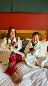 A family-friendly travel vlog showcasing a stay at The Halyard Hotel in Liverpool, including room features, dining at the on-site restaurant Voyagers, and breakfast.