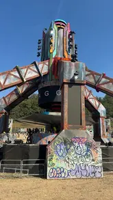 A creator explains the concept of compost toilets at a UK festival, detailing how they work and the reality of using them.