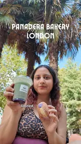 A creator visits Panadera Bakery in London, providing a review of several items including a chicken sandwich, a croissant, an ube donut, and an ube matcha iced latte. The video includes shots of the bakery's display, the kitchen, and the creator tasting the food in a nearby park.