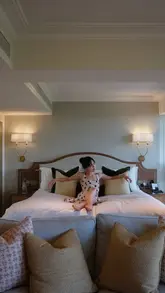 A luxury hotel staycation video showcasing a penthouse suite at The Athenaeum in London, featuring room amenities, in-room dining, and city views.