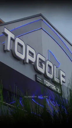 Family enjoying games, drinks, and food at Topgolf in Glasgow, Scotland's only Topgolf location.