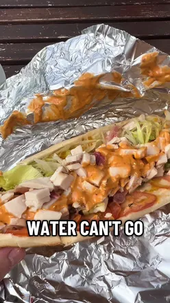 Customers enjoying delicious burritos at O’Donovans Cafe on Pearse Street, Dublin, Ireland.