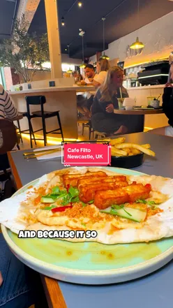 Patrons enjoying halloumi flatbread and iced lattes at Cafe Filto in Newcastle upon Tyne.
