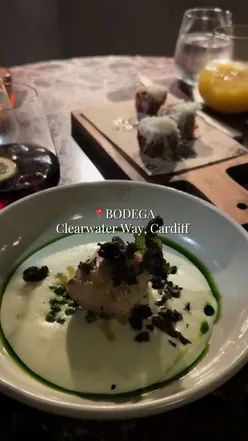 Enjoying small plates and wine at Bodega, a Mediterranean restaurant in Cardiff, surrounded by vibrant atmosphere.