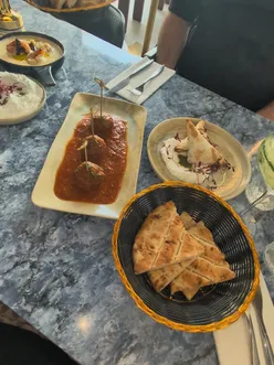 Small plates lunch at Zeus Taverna in Liverpool with hearty dishes for £20. A delicious feast experience!