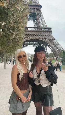 Fashionistas at Paris Fashion Week near the Eiffel Tower, showcasing glam looks and enjoying the vibrant atmosphere.