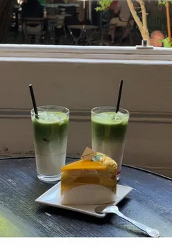 Enjoying matcha and Japanese desserts at Katsute100, a cozy cafe in Islington with a beautiful garden.