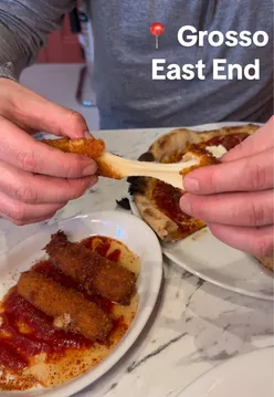 Delicious pizza and vibrant atmosphere at Grosso in the East End, Glasgow - a perfect weekend dining experience!